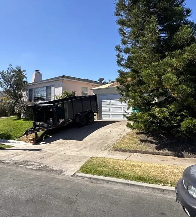 Drop-off trailer staged at a residential driveway