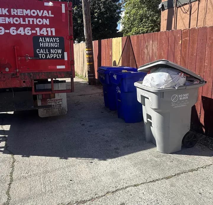 Trash bin service alongside the crew truck